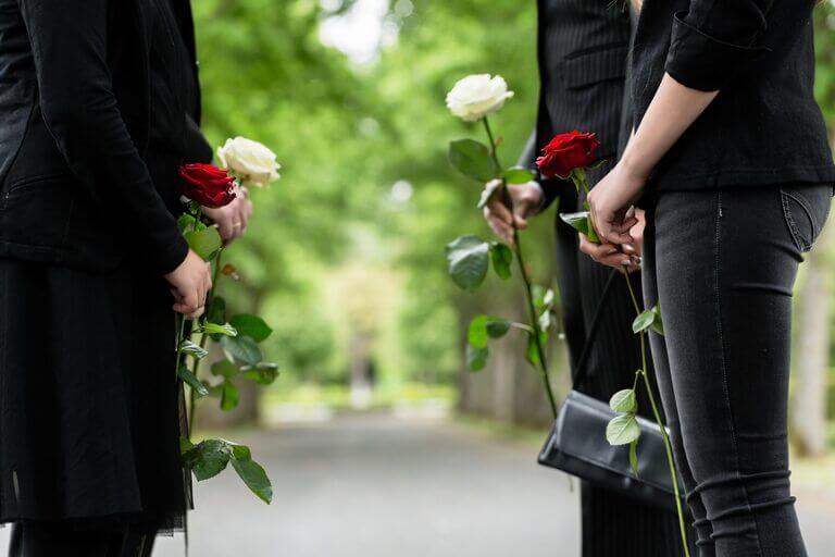 Family members grieving over a loved one in Atlanta due to his wrongful death.